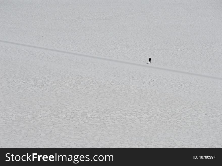 Lonely walker in Tunupa salt flats, Bolivia