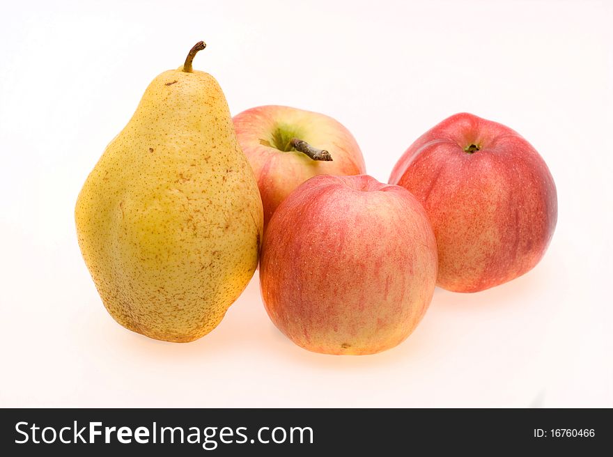 Fresh ripe apples and pears close-up on a white background. Fresh ripe apples and pears close-up on a white background