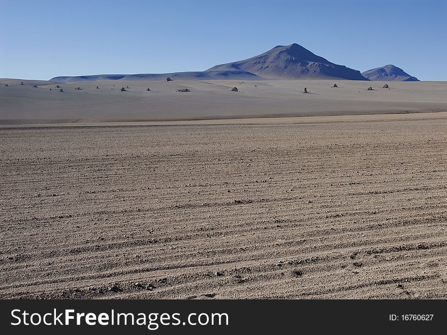 Unevenly fallen rocks of the mountains in Dali's desert, Bolivia