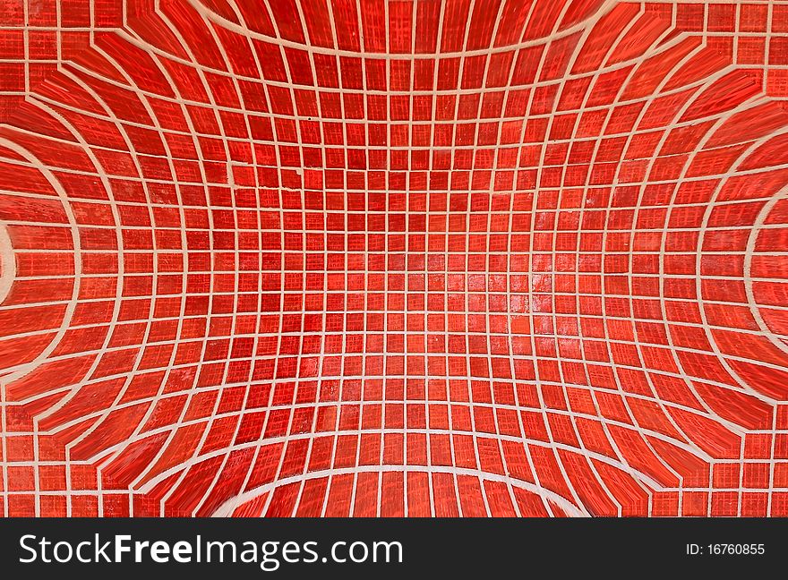 Closeup of a wall decorated with Murano glass mosaic tiles in red. Closeup of a wall decorated with Murano glass mosaic tiles in red