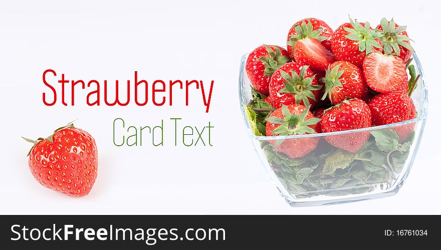 Strawberry with green leaf in the glass wase