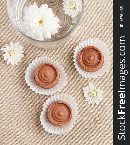 Homemade sweet chocolatewith white flowers