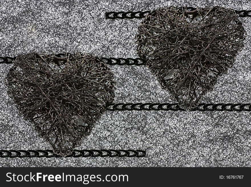 Heart of steel wire and chain isolated on white background.