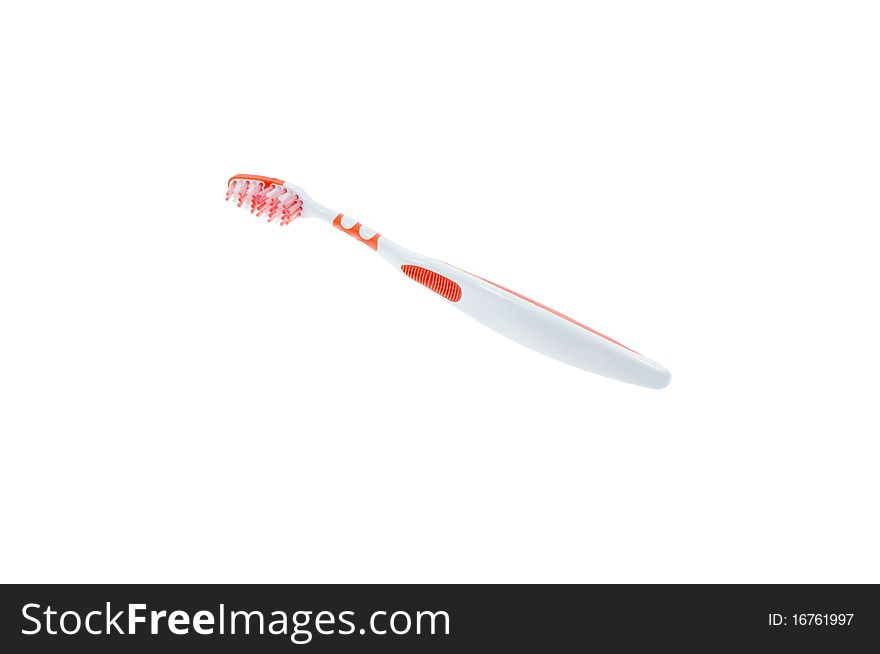 White orange thoothbrush on white