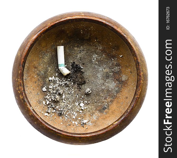 Old wooden ashtray with ash and crushed cigarette