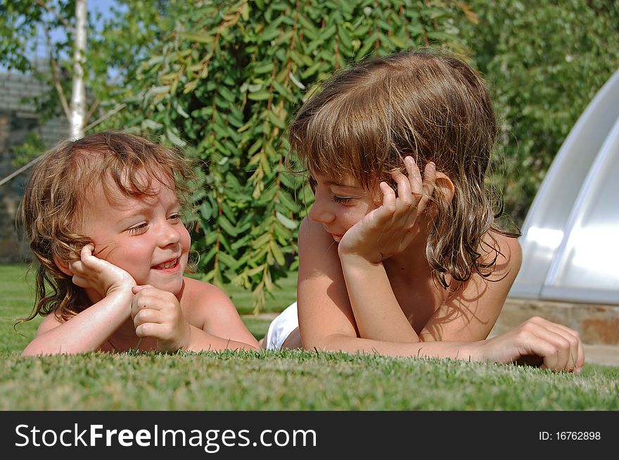 Two sisters having fun in garden