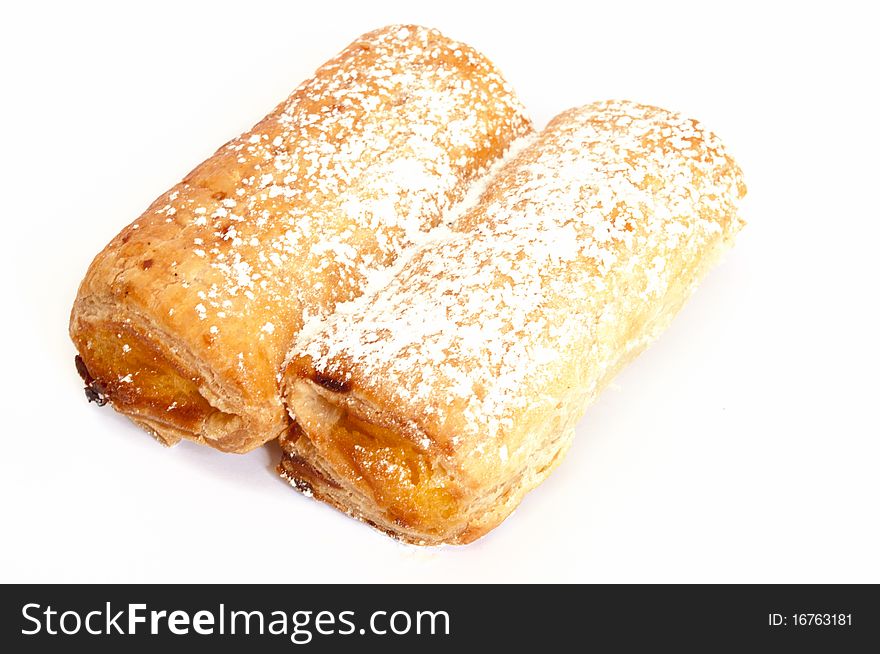 Two rolls with yellow jam isolated over white