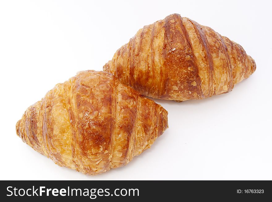 Two butter rolls isolated over white