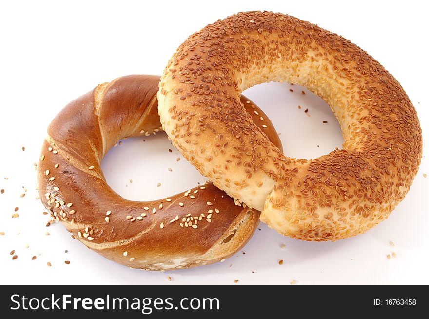 Two white breads in form of rings isolated over white