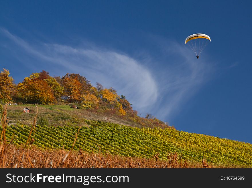 Paraglider in a blue sky