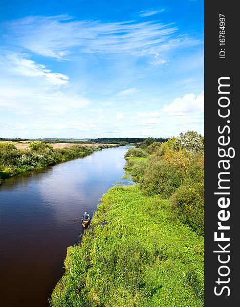 Blue river, cloud sky, green shors