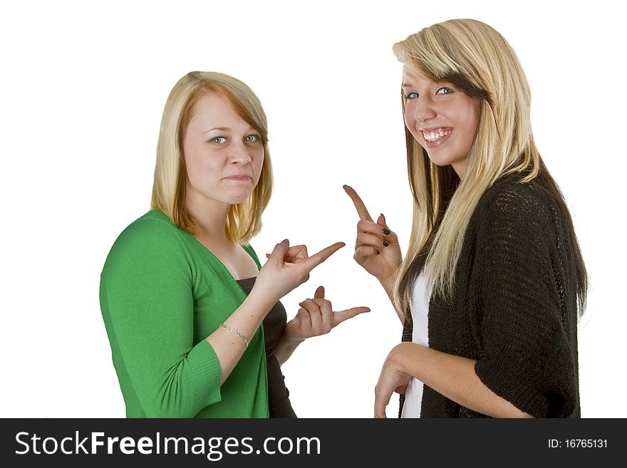 Two young caucasian girlfriends having fun together isolated over white background. Two young caucasian girlfriends having fun together isolated over white background