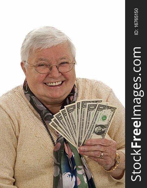 Old woman holding dollars and laughing - isolated on white. Old woman holding dollars and laughing - isolated on white