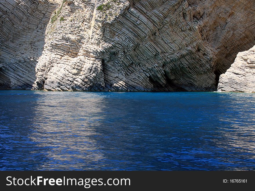 Rocky coast in corfu, greece. structure. unbelievably blu sea. Rocky coast in corfu, greece. structure. unbelievably blu sea.