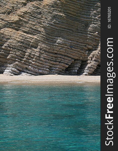 Seaside in corfu, greece. structured rocks.