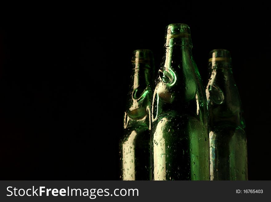 Vintage style soda bottles in dark background