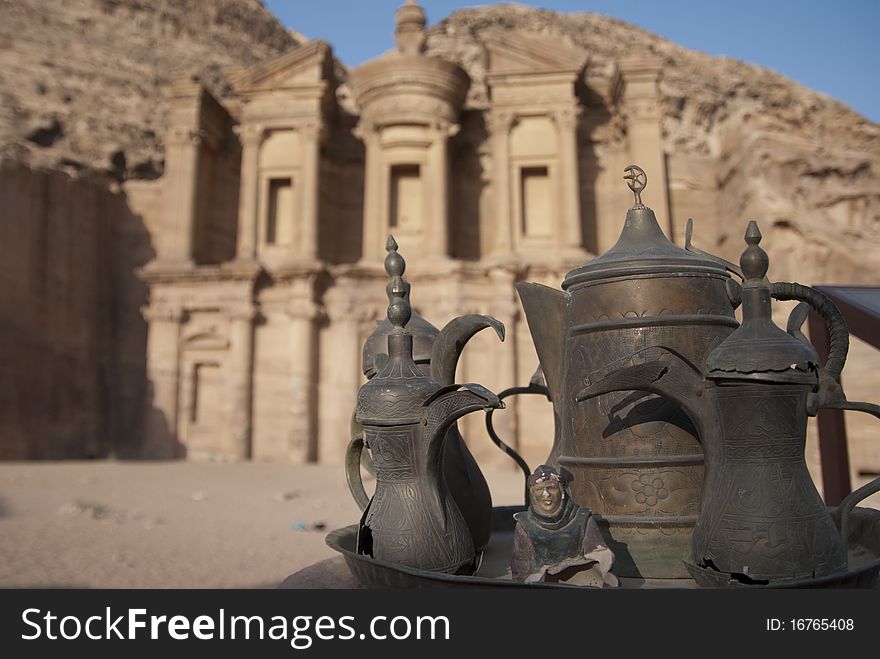 Trditional tea set in front of Petra's Monastery at sunset