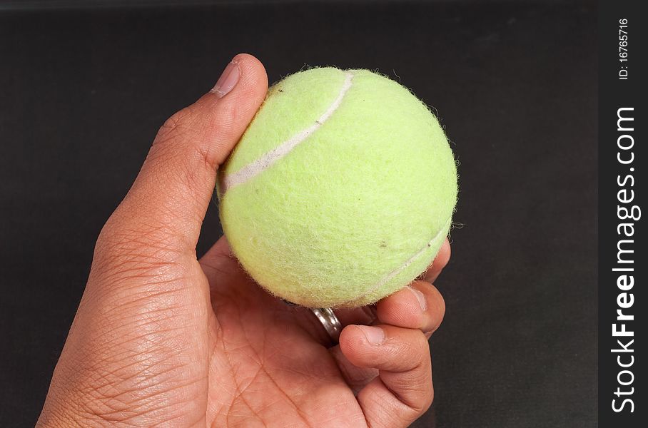 Hand Holding a Tennis Ball