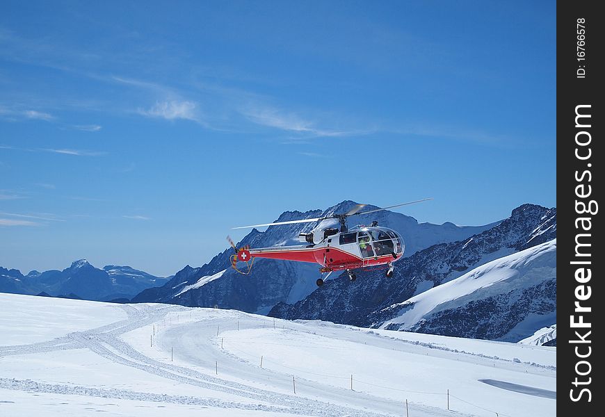 Vehicles flying helicopter for rescue Life at Jungfraujoch Top of Europe in the Swiss Mountains. Vehicles flying helicopter for rescue Life at Jungfraujoch Top of Europe in the Swiss Mountains