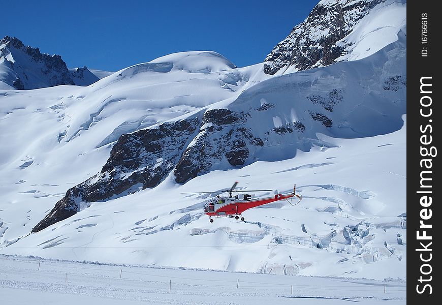 Vehicles flying helicopter for rescue Life at Jungfraujoch Top of Europe in the Swiss Mountains. Vehicles flying helicopter for rescue Life at Jungfraujoch Top of Europe in the Swiss Mountains