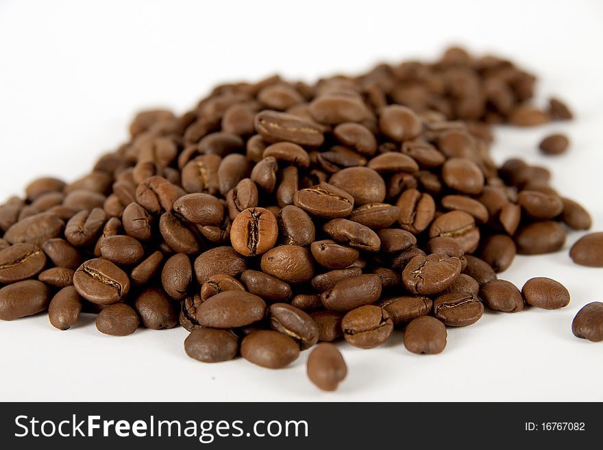 Coffee grains on a white background. Coffee grains on a white background