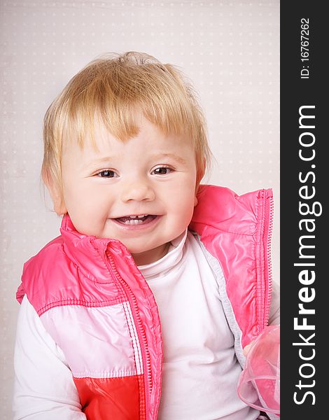 Portrait of happy smiling baby girl, studio shot