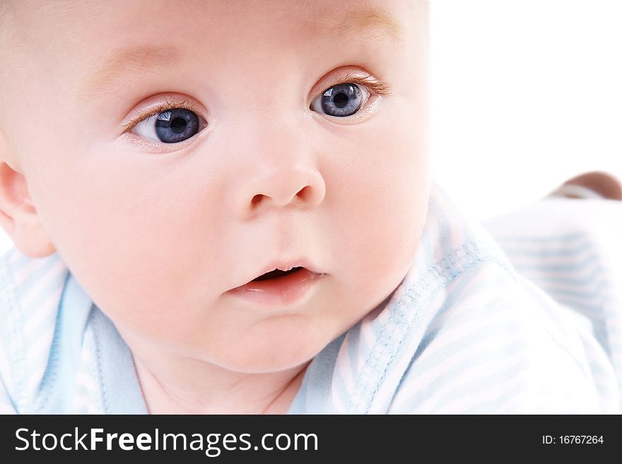 Close -up portrait of cute little baby boy in studio