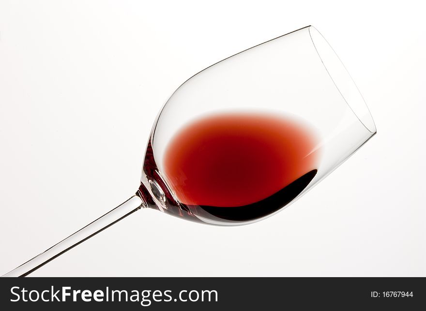 Glass of red wine and white background