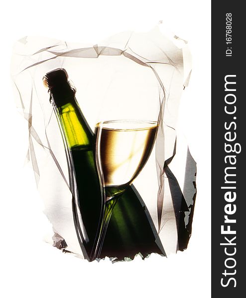 Glass and bottle of white wine presented in an artistic way. Glass and bottle of white wine presented in an artistic way