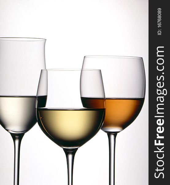 Three glasses of wine with a white background