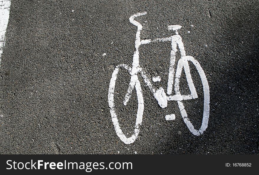 White sign of bicycle path on gray background. White sign of bicycle path on gray background