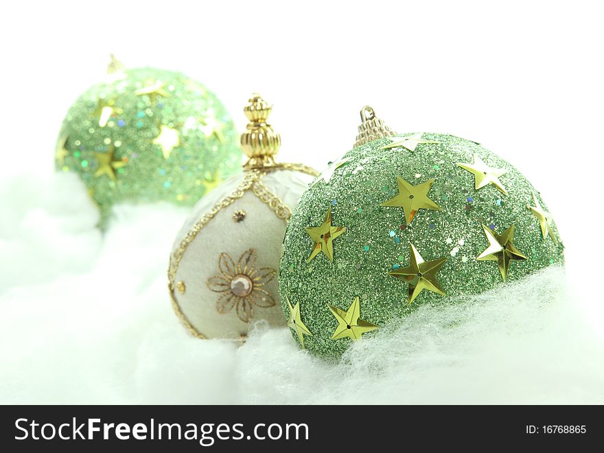 Green Christmas balls on cloudy background. Xmas image