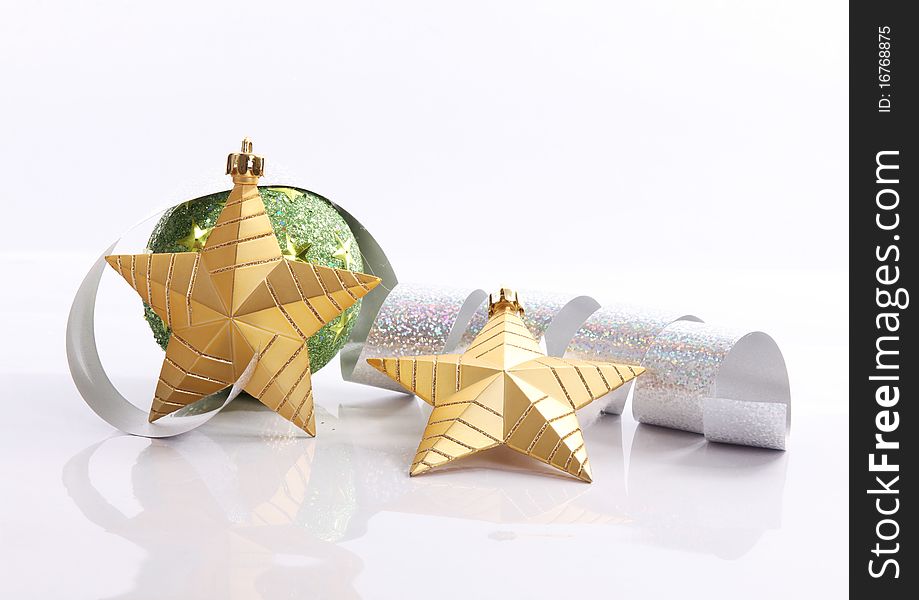 Gold star with serpentine and green ball, xmas image. Gold star with serpentine and green ball, xmas image