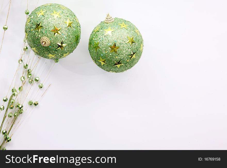 Green christmas balls on white background, Space to add text or design. Green christmas balls on white background, Space to add text or design