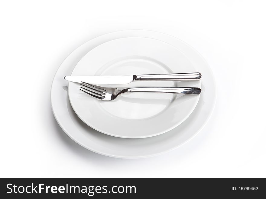 With fork and knife isolated on white. With fork and knife isolated on white