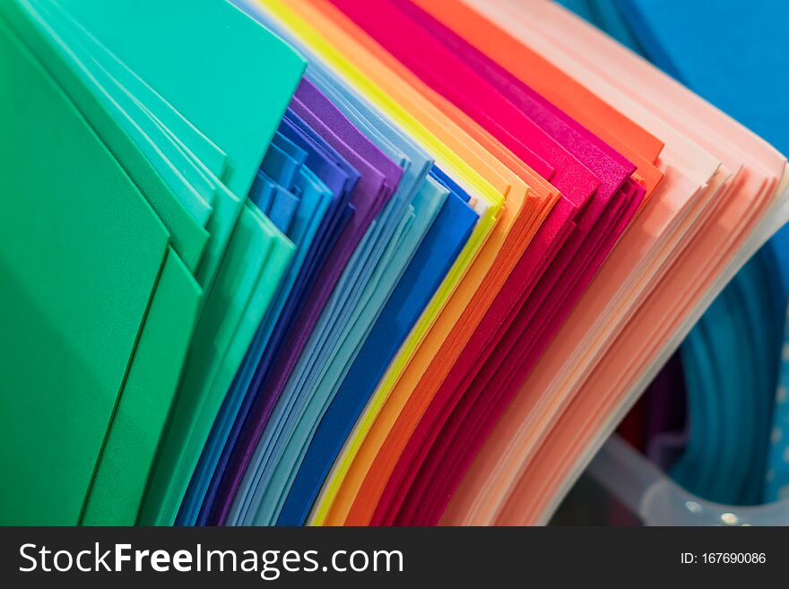 An assortment of multicolored fleece sheets for craft