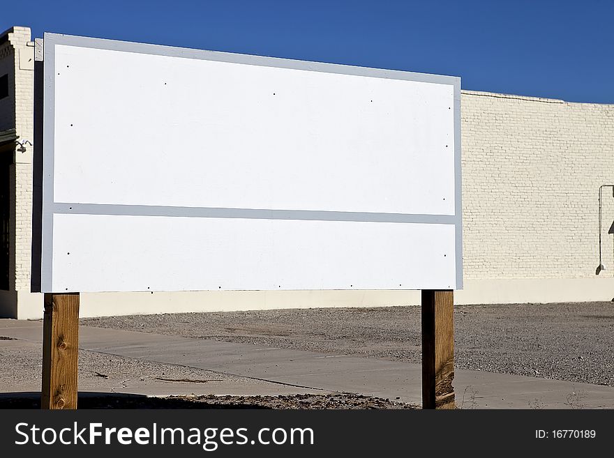 Blank, white sign on the side of a road. Blank, white sign on the side of a road