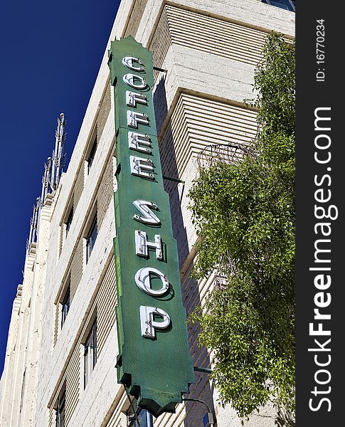 A green, retro coffee shop sign