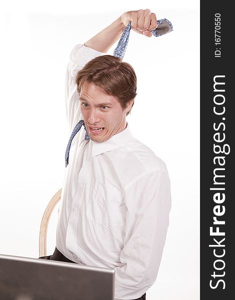 A man pulling on his tie showing that he is stressed out. A man pulling on his tie showing that he is stressed out.