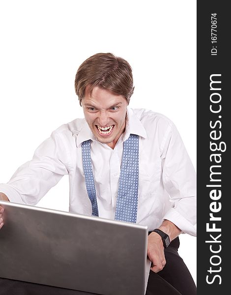 A business man getting ready to throw his computer because of his anger. A business man getting ready to throw his computer because of his anger.