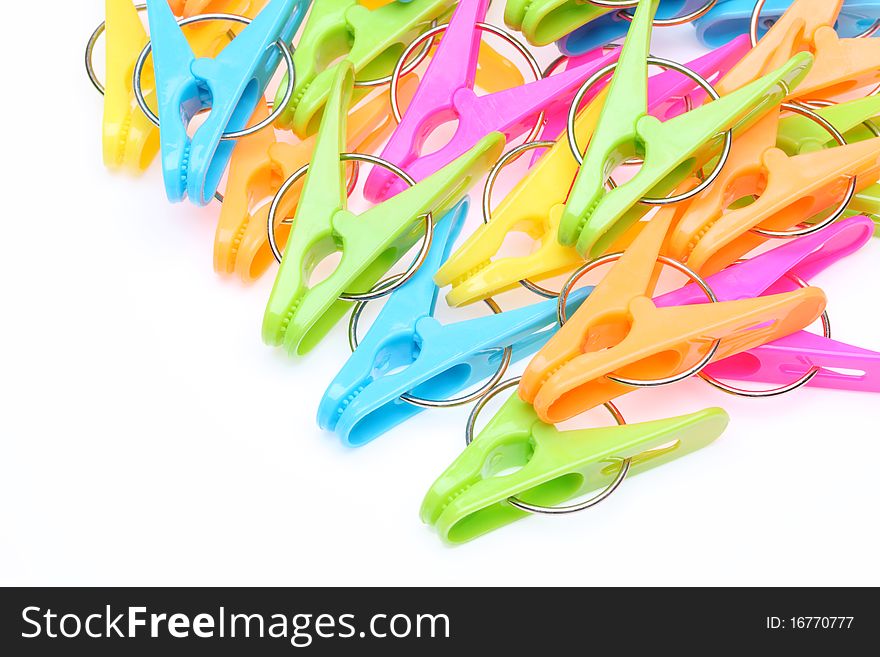 Plastic clothespins isolated on white background