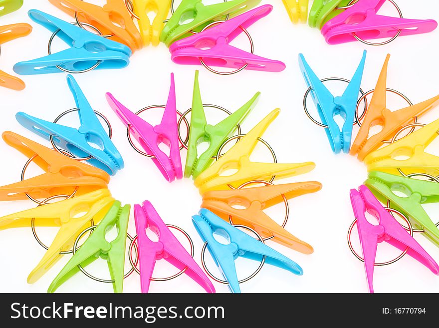 Colorful clothespins isolated on white background