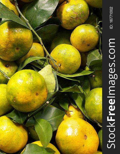 Stack of orange with leaf in market, shown as raw, fresh and healthy fruit. Stack of orange with leaf in market, shown as raw, fresh and healthy fruit.