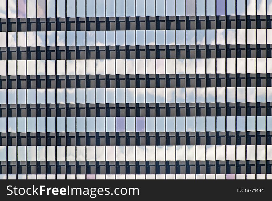 Reflection of sky in windows of an office building. Reflection of sky in windows of an office building