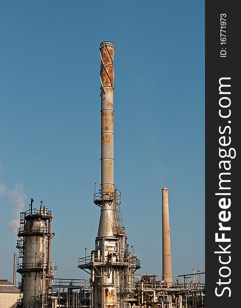 A petrochemical refinery plant with pipes and cooling towers.