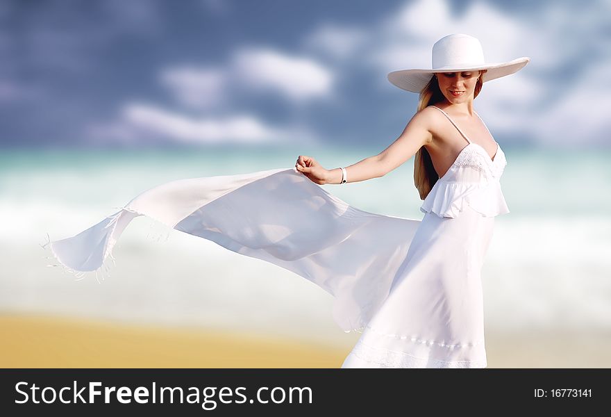 Young beautiful women in the white with pareo on the sunny tropical beach. Young beautiful women in the white with pareo on the sunny tropical beach