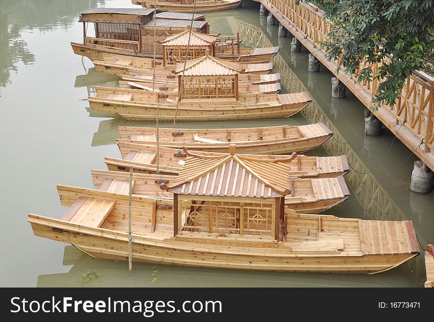 A row of wooden boats in the river shore, the Pearl river,Guangdhong,China.