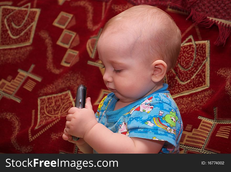 Photo of the little boy with mobile phone