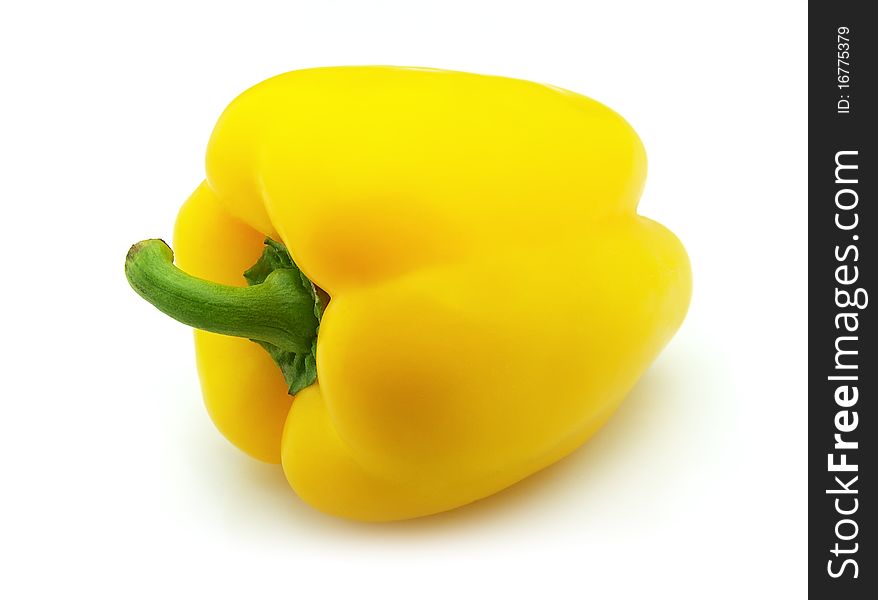 Sweet pepper of yellow color on a white background