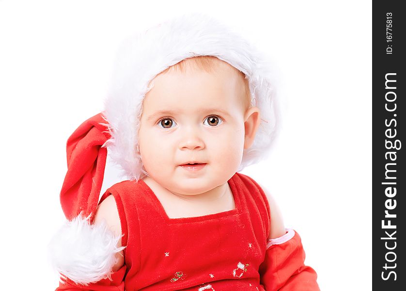 Baby in Santa Claus hat on white background